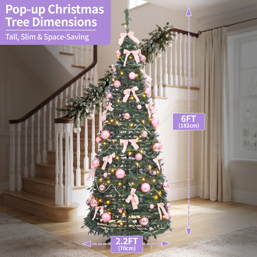 A decorated pop-up Christmas tree stands in a home interior with staircase and curtains visible. Purple measurement callouts show the tree height as 6FT (182cm) and width as 2.
