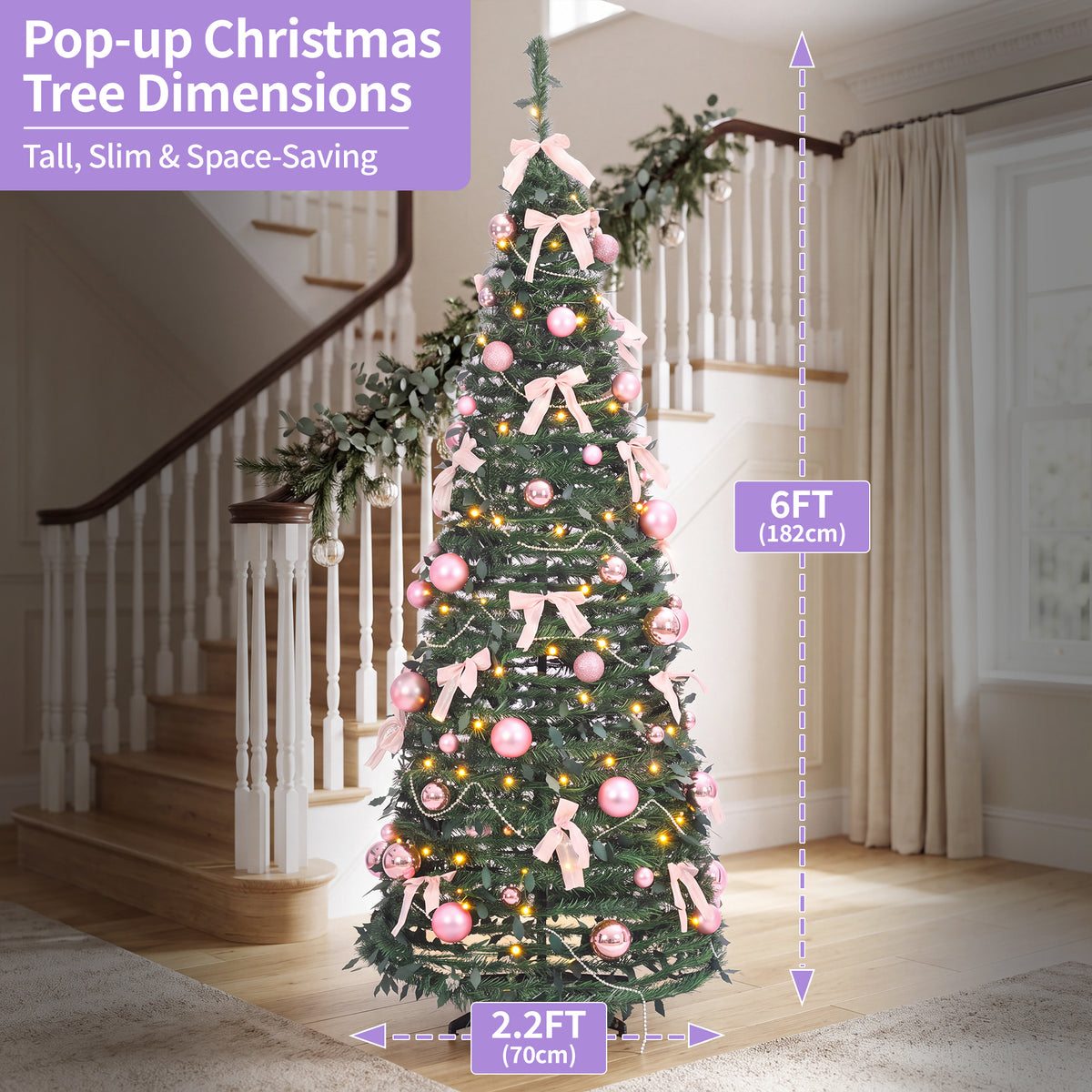 A decorated pop-up Christmas tree stands in a home interior with staircase and curtains visible. Purple measurement callouts show the tree height as 6FT (182cm) and width as 2.