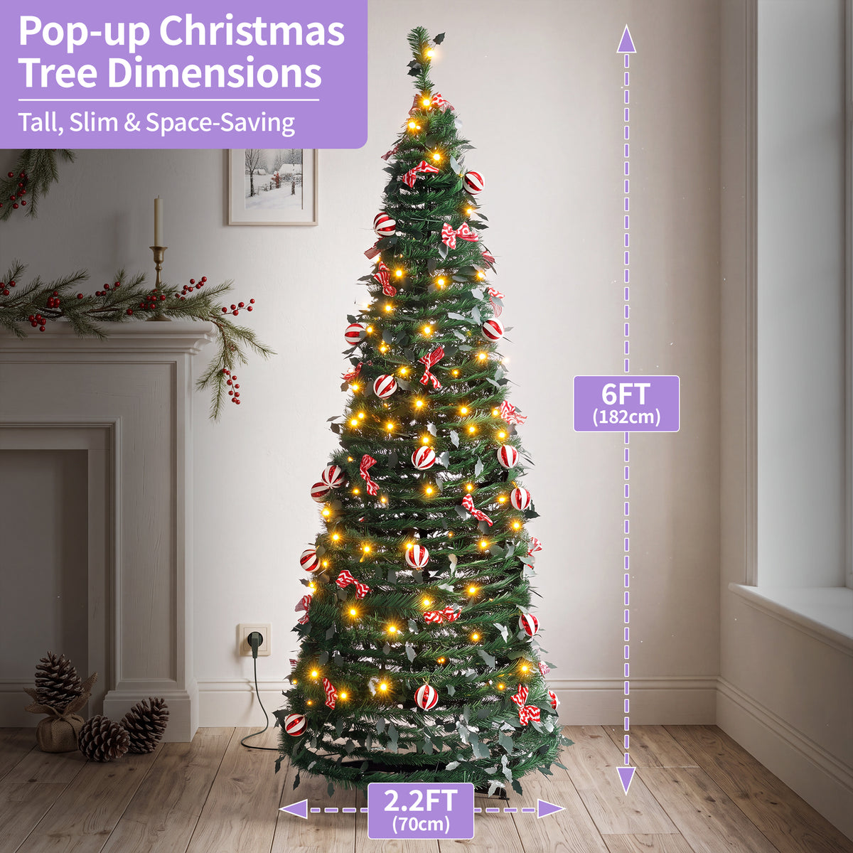 A decorated pop-up Christmas tree stands in a real indoor room with a fireplace, wood floor, and wall, with overlaid dimension callouts showing 6FT (182cm) tall and 2.2FT (70cm) wide.