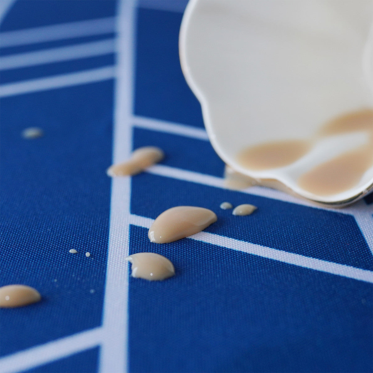 70" Round Premium Waterproof Polyester Tablecloth - Blue with White Arrows