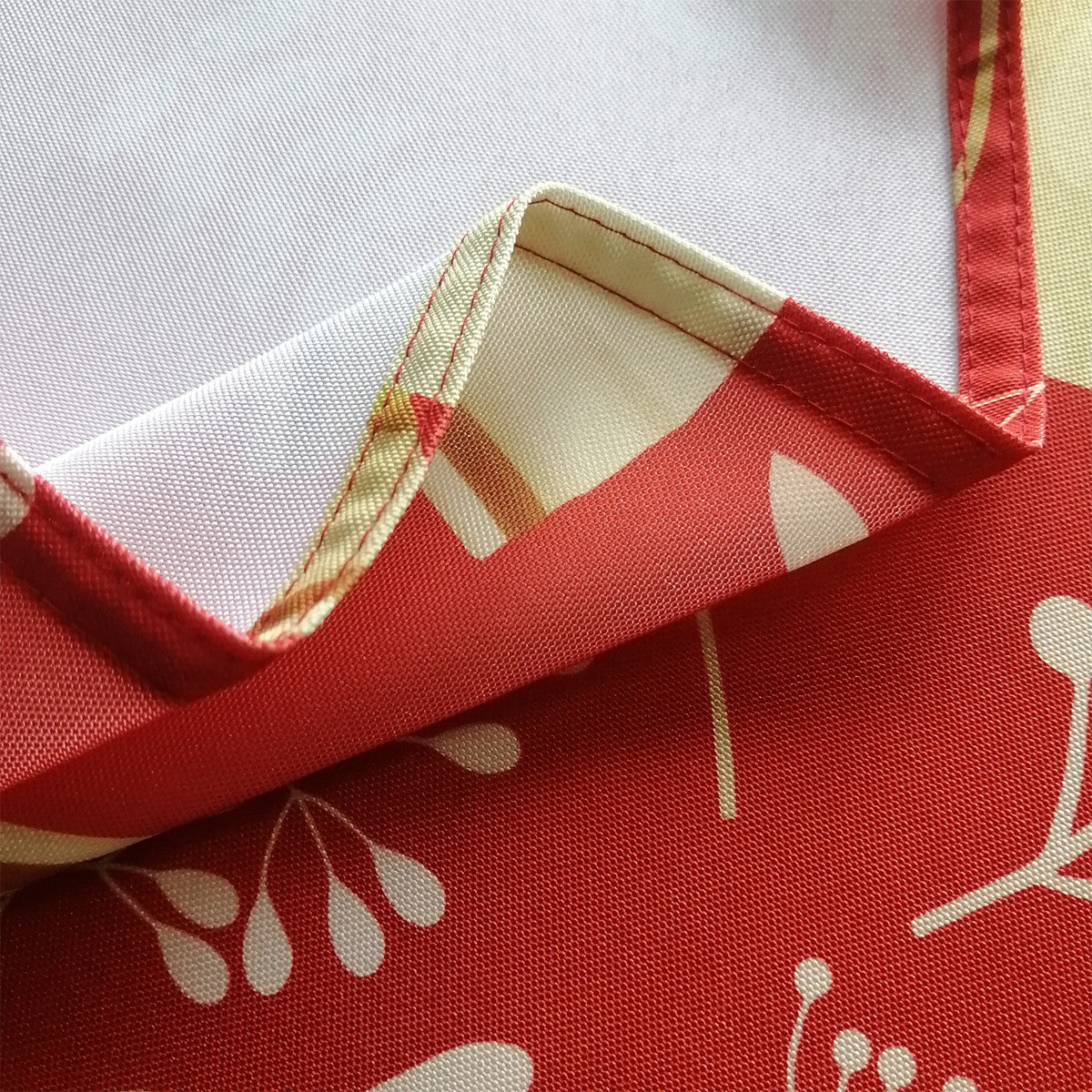 60" x 84" Rectangle Christmas Ribbon & Leaf Print Polyester Wipe Clean Tablecloth - Red & Gold